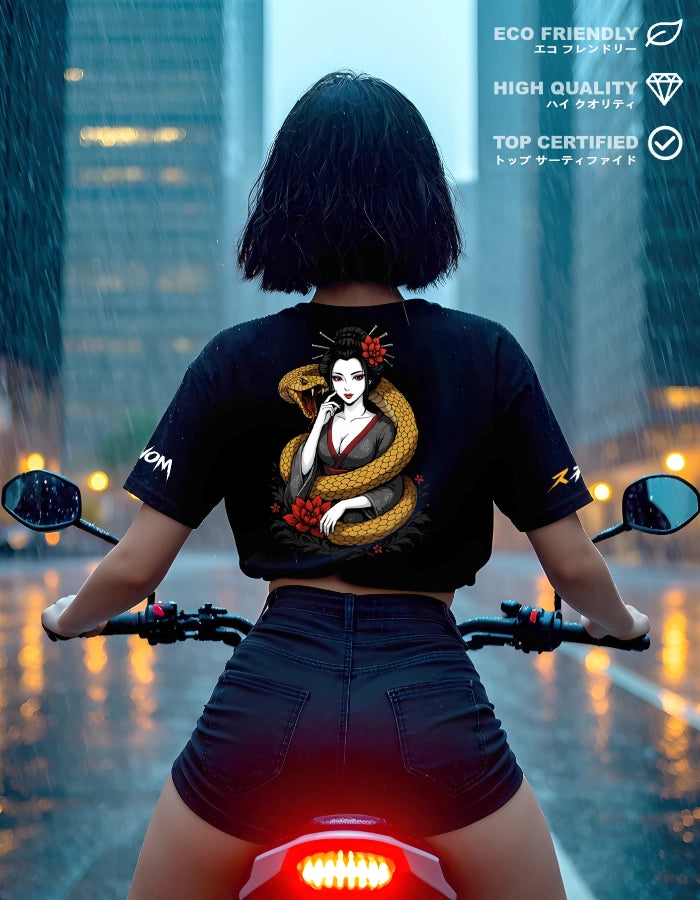 Lifestyle shot: rider on motorcycle in rain wearing black tee; back print shows geisha wrapped by a golden viper with red lotus accents.