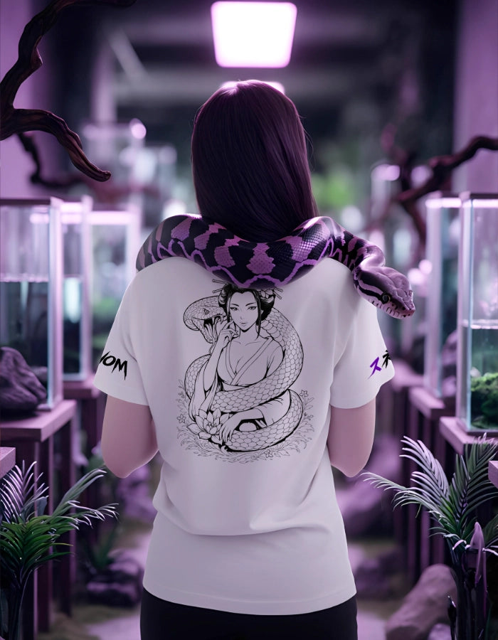 Model in terrarium setting wearing white tee; back print features geisha wrapped by a snake. Eco-friendly, high-quality Japanese streetwear.