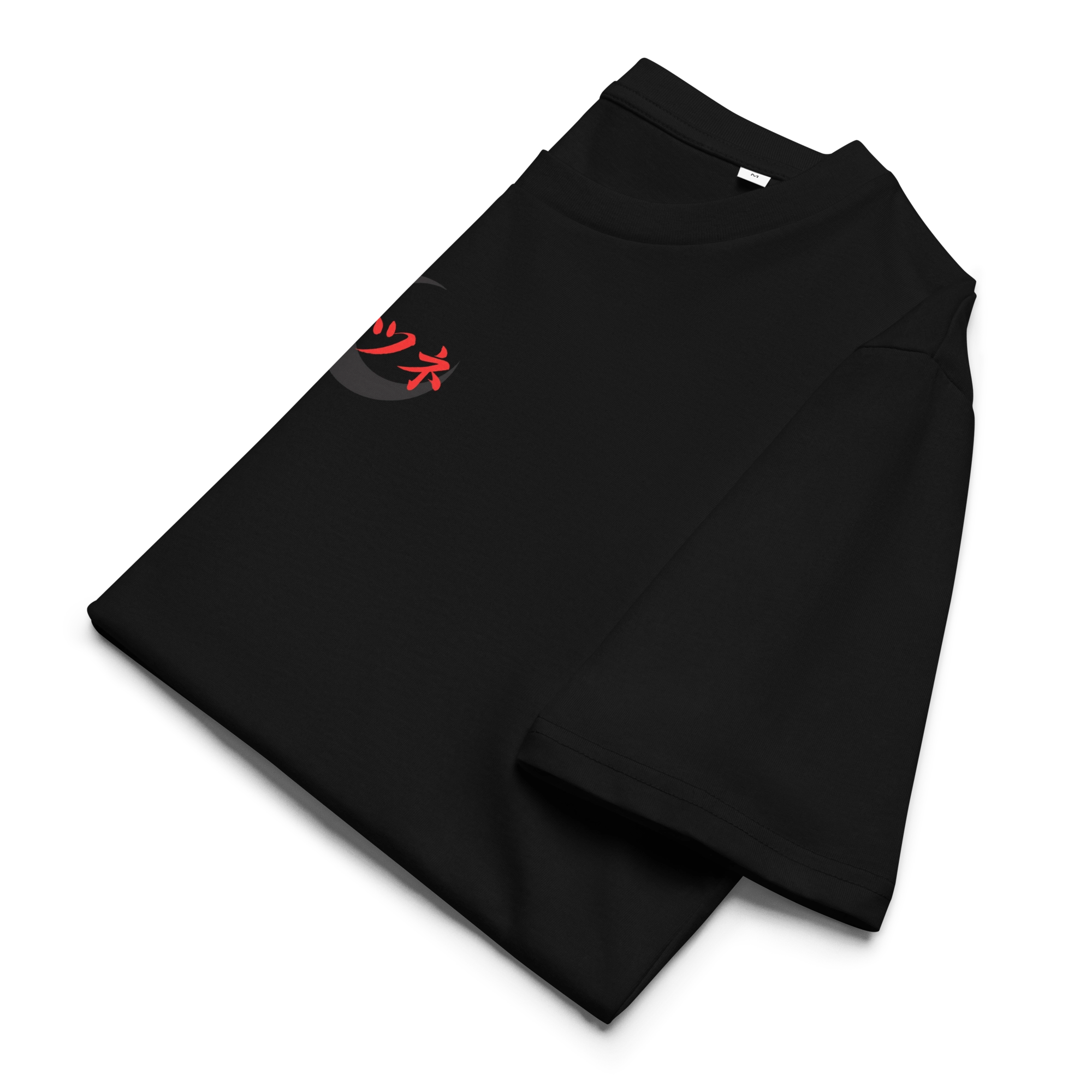Folded black T-shirt with red "Kitsune" katakana lettering over a dark crescent moon. A minimalist Japanese streetwear piece made from soft, sustainable fabric.