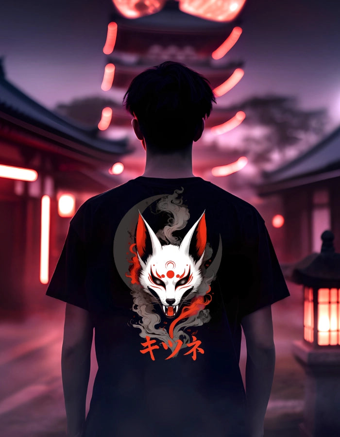 Model wearing a black unisex T-shirt with a white Kitsune fox design, red markings, smoke details, and katakana text. Set in a moody Japanese street scene with glowing lanterns.