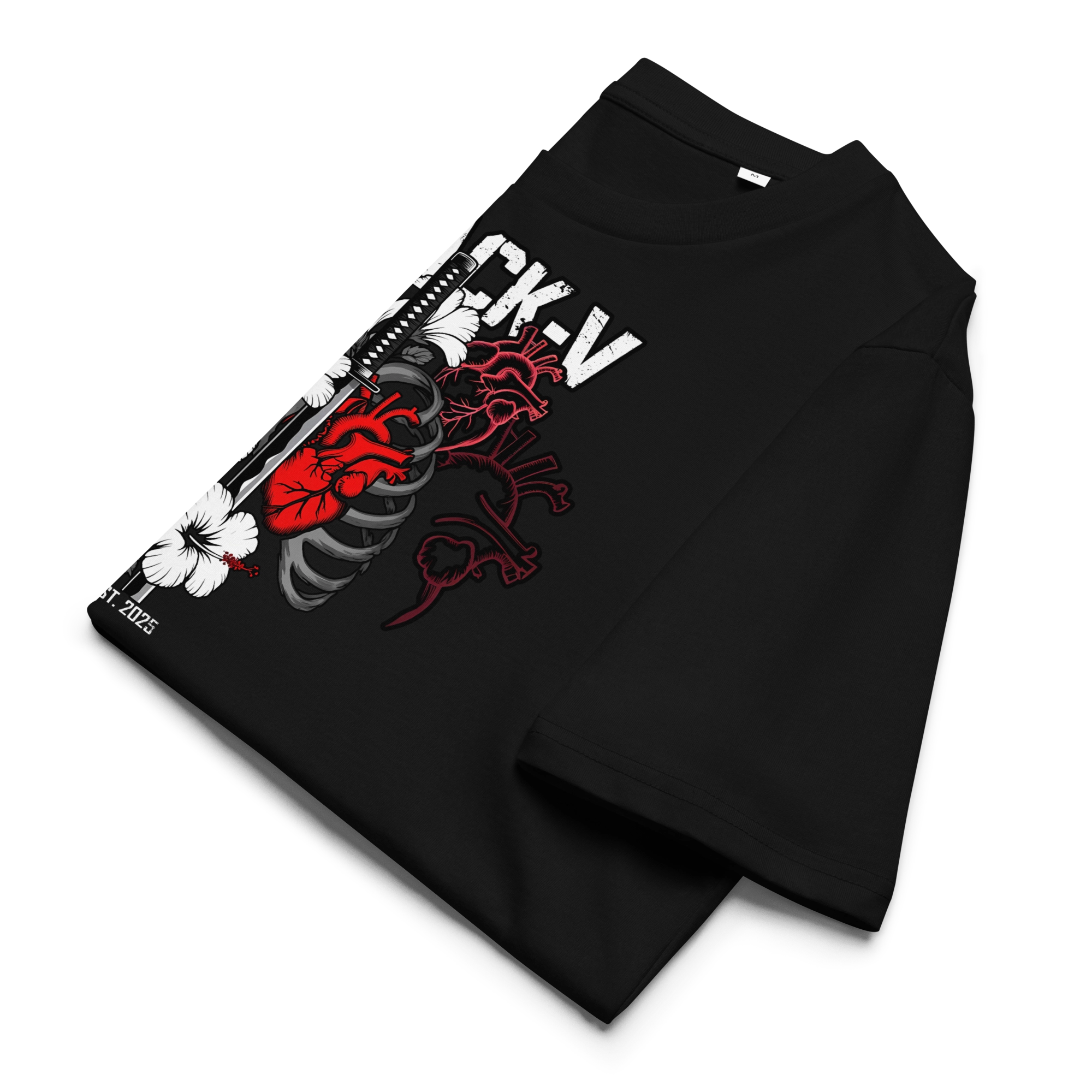 Folded black T-shirt featuring a bold graphic of a red anatomical heart, ribs, katana sword, and hibiscus flowers. Tattoo-inspired design on eco-friendly fabric.